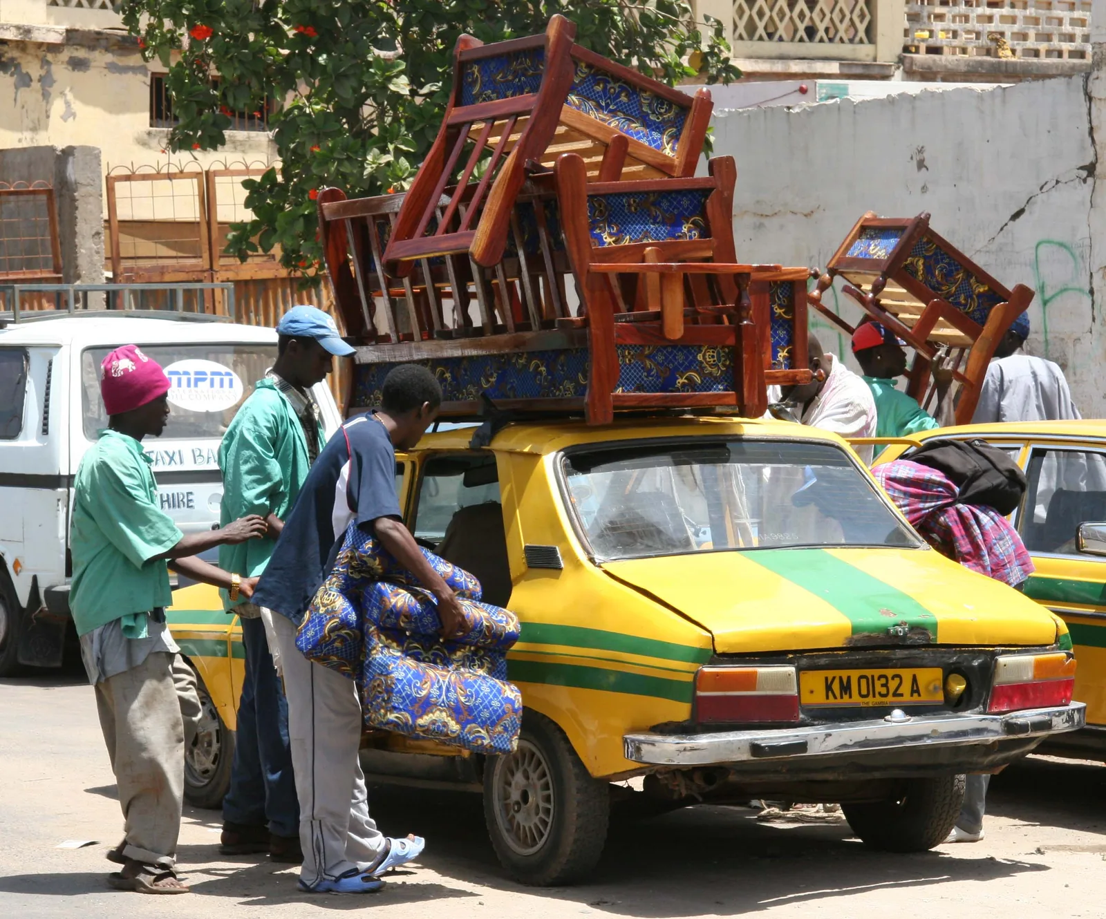 Gambian taxi used as a provisional airport-transfer context image